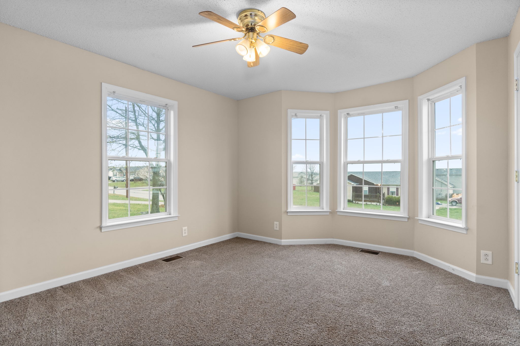 622 Avondale Road Oak Grove, KY 42262 - Photo 17 of 29 a view of an empty room with windows and chandelier fan