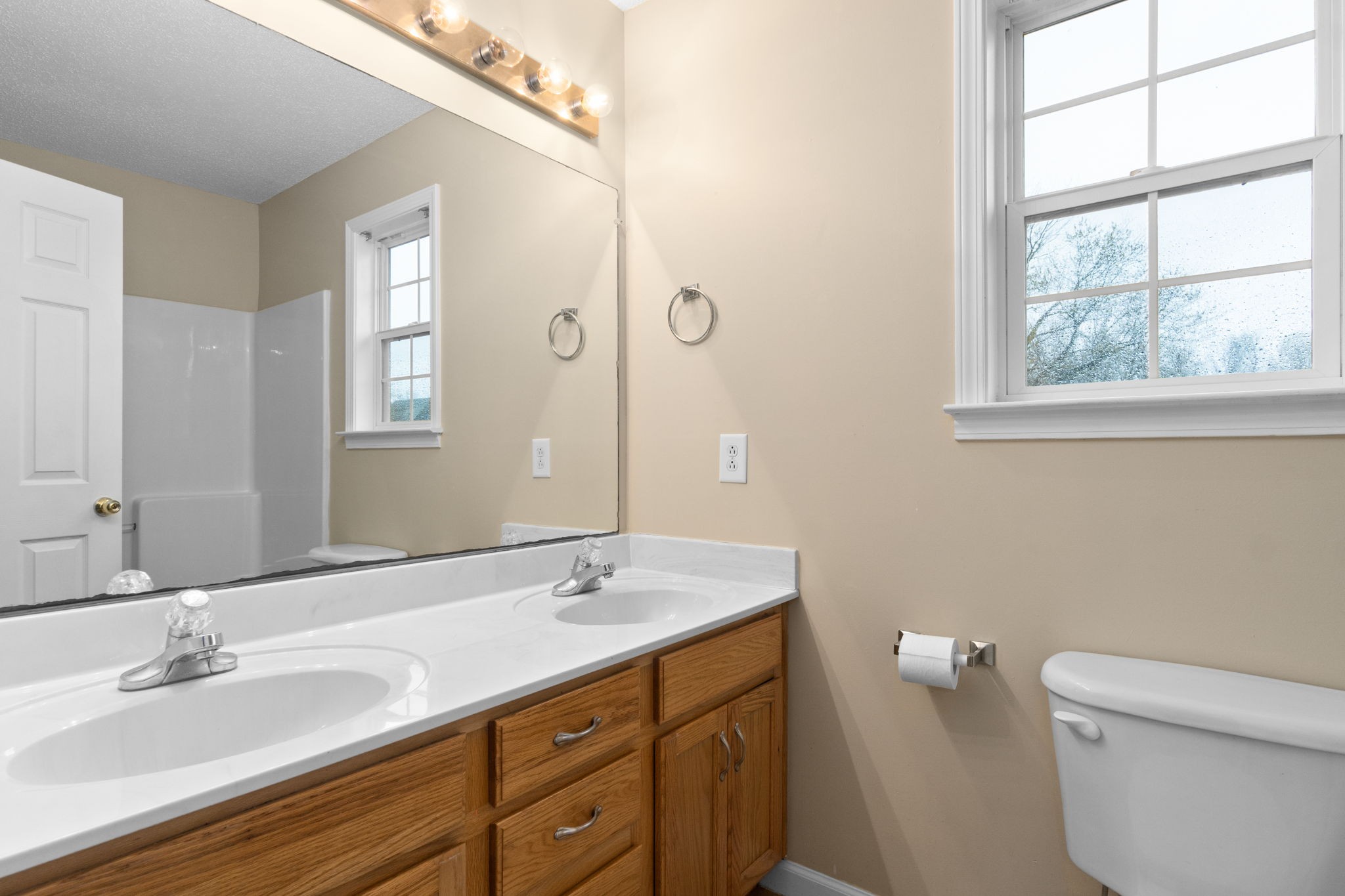 622 Avondale Road Oak Grove, KY 42262 - Photo 21 of 29 a bathroom with a granite countertop sink a toilet and a window