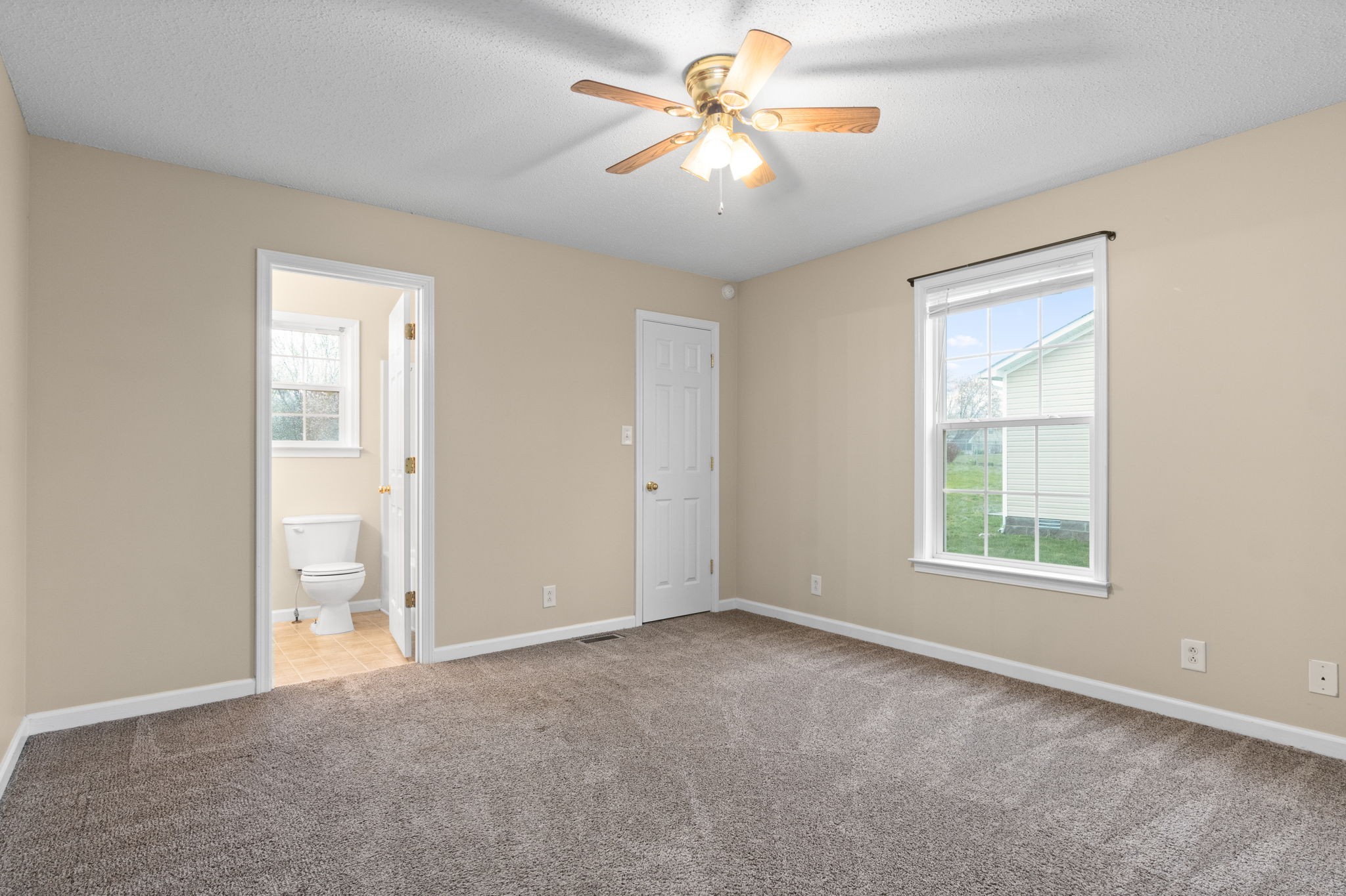 622 Avondale Road Oak Grove, KY 42262 - Photo 23 of 29 an empty room with chandelier fan and windows