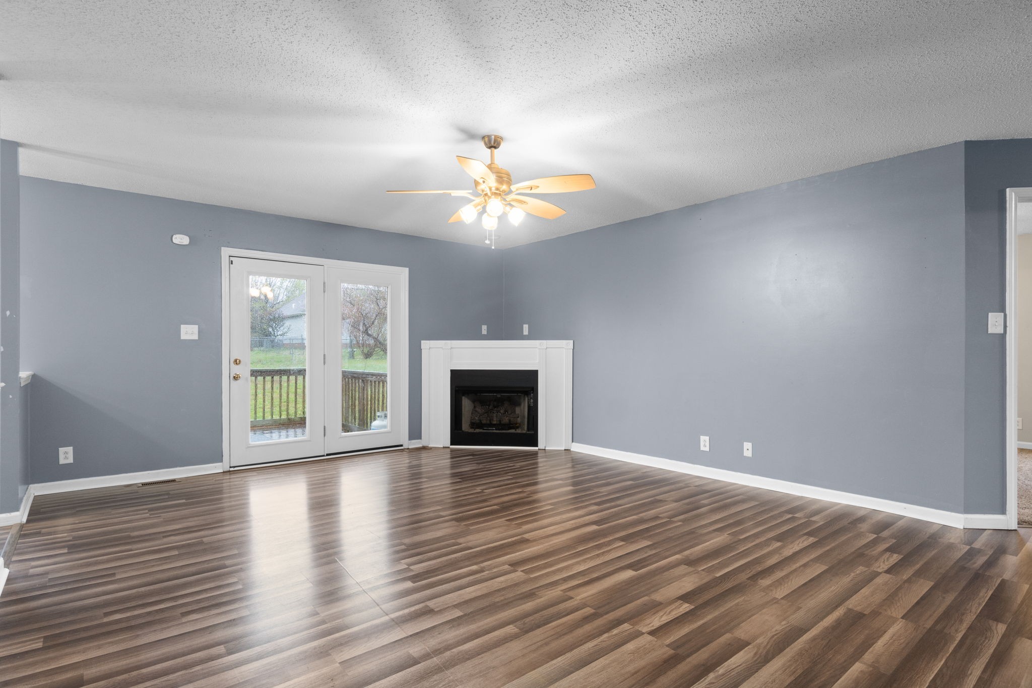 622 Avondale Road Oak Grove, KY 42262 - Photo 6 of 29 a view of an empty room with a window and wooden floor