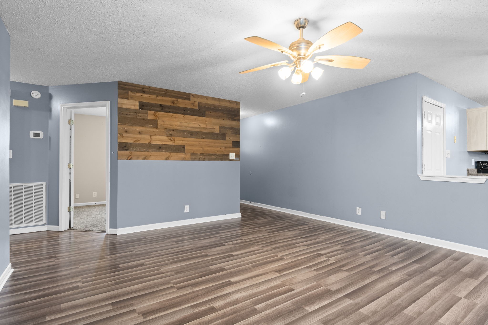 622 Avondale Road Oak Grove, KY 42262 - Photo 8 of 29 a view of an empty room with window and wooden floor