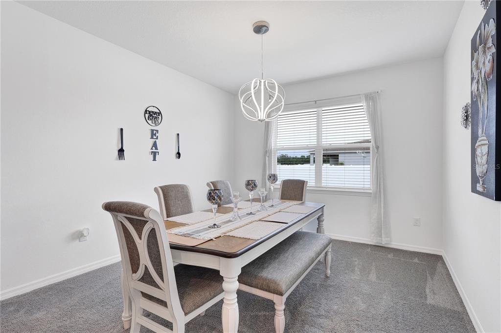 7185 Southwest 63rd Street Ocala, FL 34474 - Photo 16 of 31 a view of a dining room with furniture and window