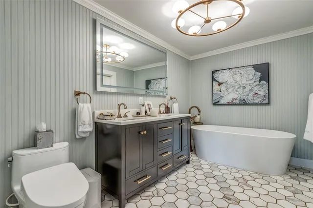 a bathroom with a toilet a sink and a bathtub