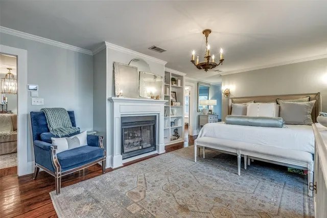 a bedroom with a bed and a fireplace