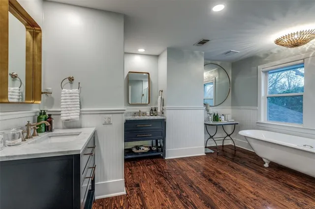 a view of living room and kitchen with wooden floor