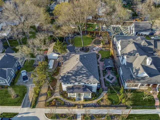 an aerial view of a residential houses with outdoor space