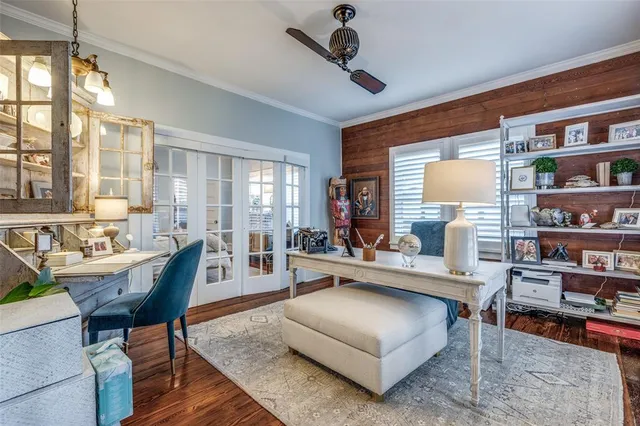 a living room with furniture a rug and a large window