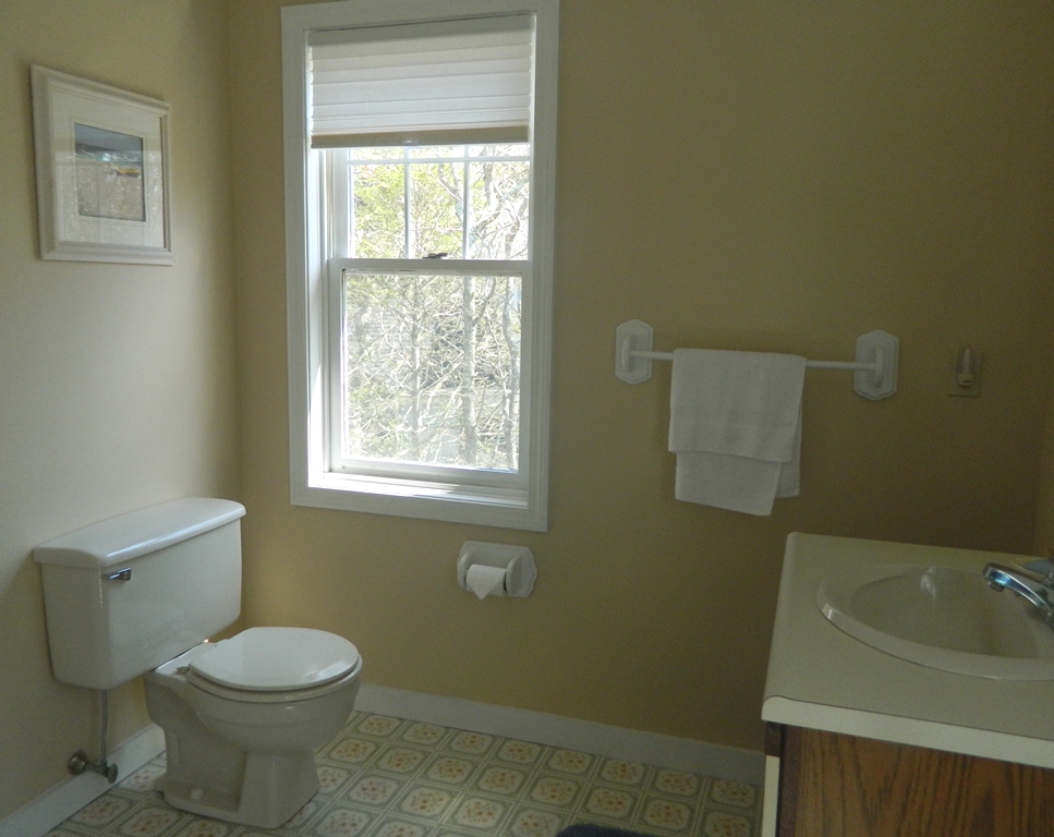 78 Old Purchase Road Edgartown, MA 02539 - Photo 12 of 17 a bathroom with a toilet sink and window