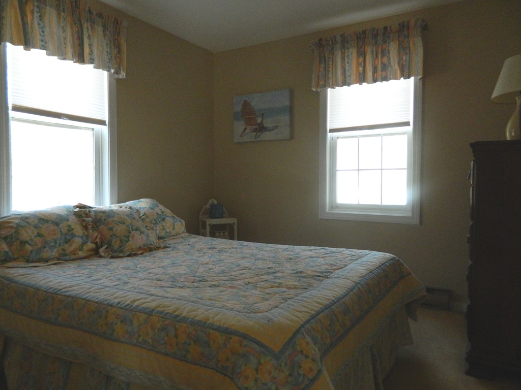 78 Old Purchase Road Edgartown, MA 02539 - Photo 16 of 17 a bedroom with a bed and a window
