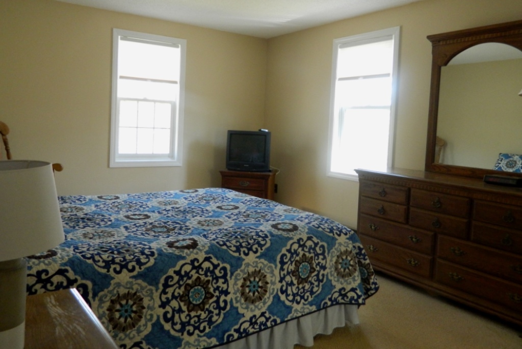 78 Old Purchase Road Edgartown, MA 02539 - Photo 10 of 17 a bedroom with a bed and a window