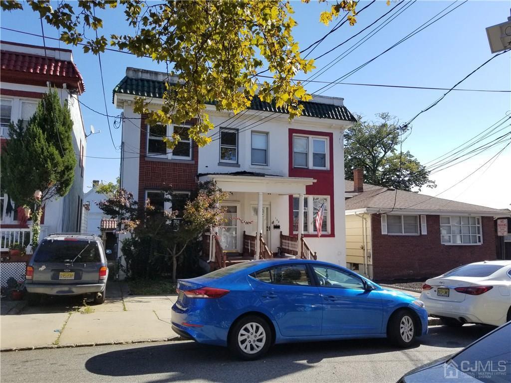 a car parked in front of a house