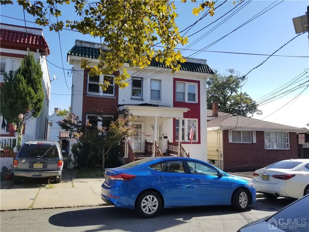 110 Rector Street Perth Amboy, NJ 08861 - Photo 2 of 15 a car parked in front of a house