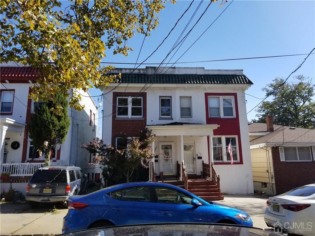 110 Rector Street Perth Amboy, NJ 08861 - Photo 3 of 15 a front view of a house with a yard