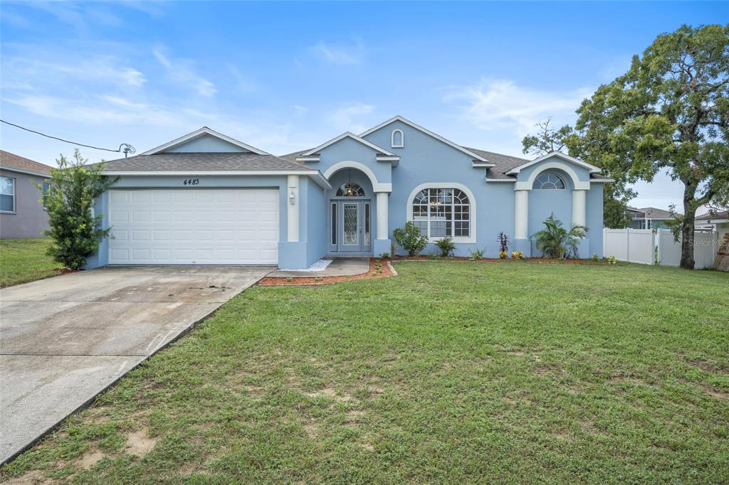 4483 Detroit Street Spring Hill, FL 34608 - Photo 1 of 1 a front view of a house with yard