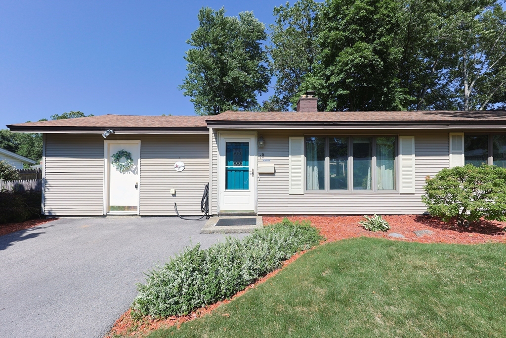 18 Paxton Road Framingham, MA 01701 - Photo 1 of 37 a front view of a house with garden