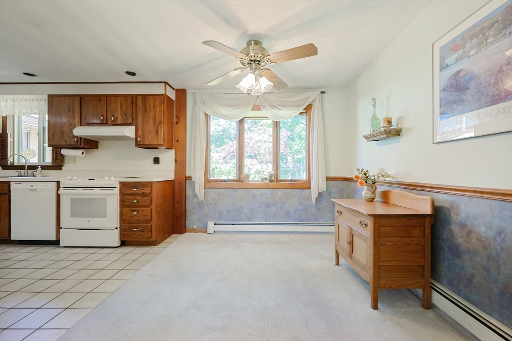 18 Paxton Road Framingham, MA 01701 - Photo 12 of 37 a spacious bedroom with a bed a window and a chandelier