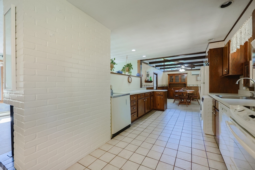 18 Paxton Road Framingham, MA 01701 - Photo 16 of 37 a kitchen with stainless steel appliances a sink and cabinets