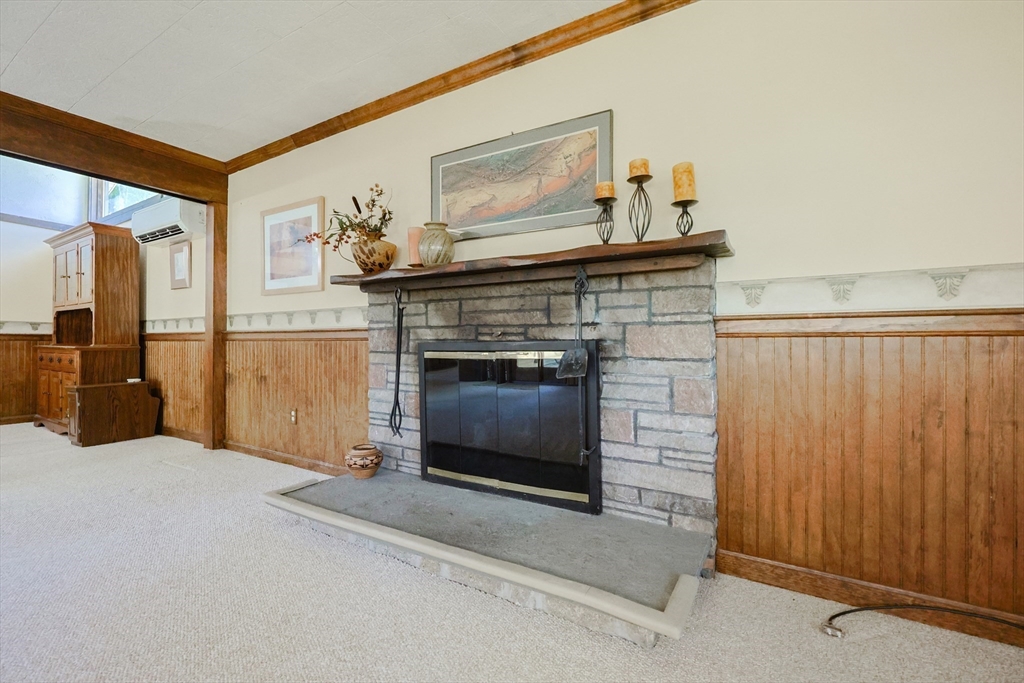 18 Paxton Road Framingham, MA 01701 - Photo 20 of 37 a living room with furniture and a fireplace