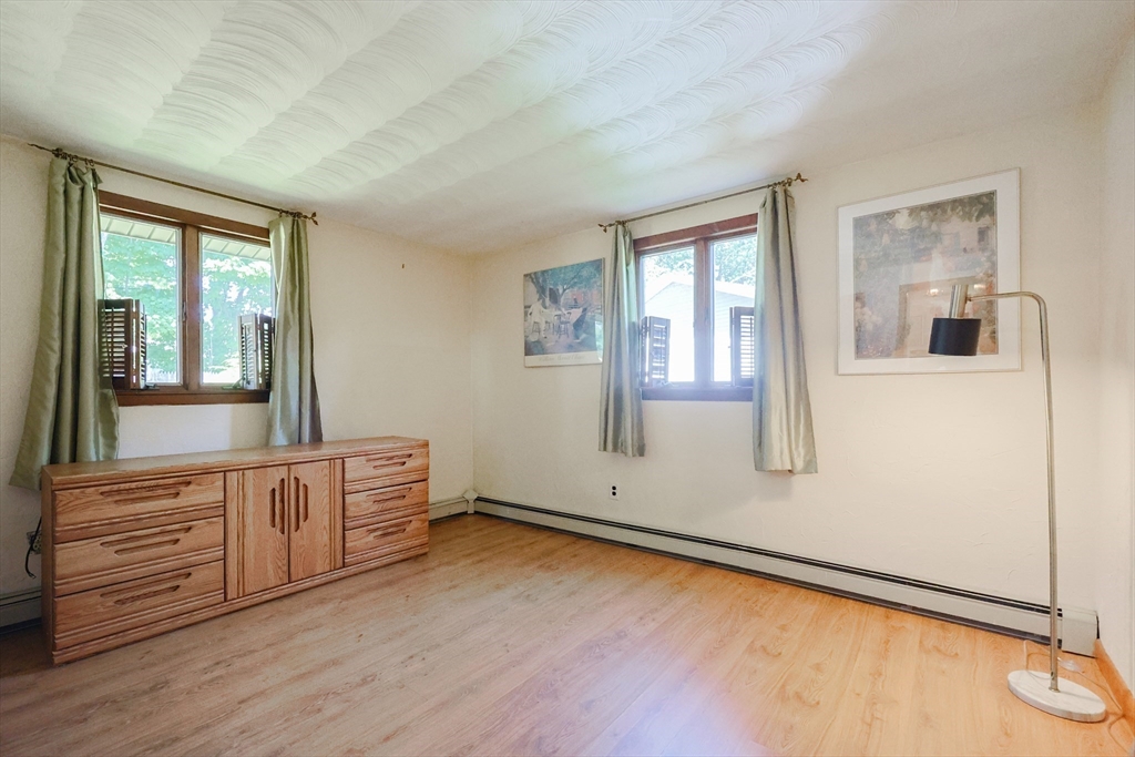 18 Paxton Road Framingham, MA 01701 - Photo 22 of 37 a view of an empty room with a window and wooden floor