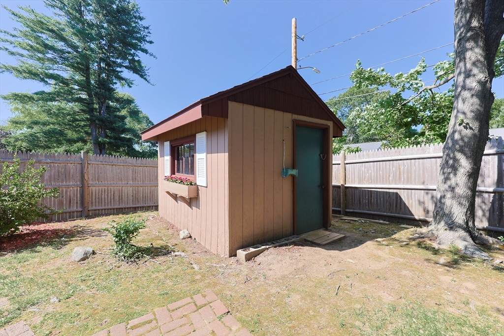 18 Paxton Road Framingham, MA 01701 - Photo 32 of 37 a backyard of a house with a tree in the background