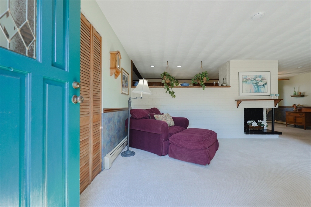 18 Paxton Road Framingham, MA 01701 - Photo 4 of 37 a living room with furniture and a fireplace