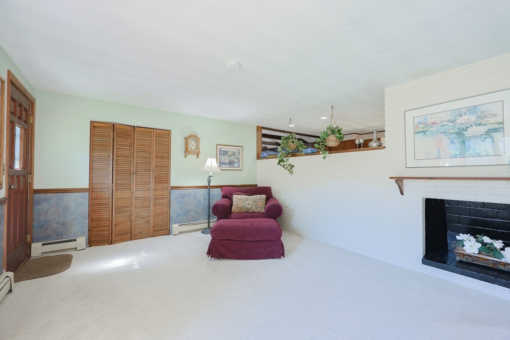 18 Paxton Road Framingham, MA 01701 - Photo 6 of 37 a living room with furniture and a fireplace