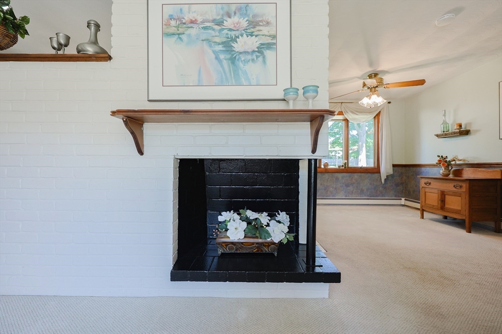 18 Paxton Road Framingham, MA 01701 - Photo 7 of 37 a living room with furniture and a fireplace