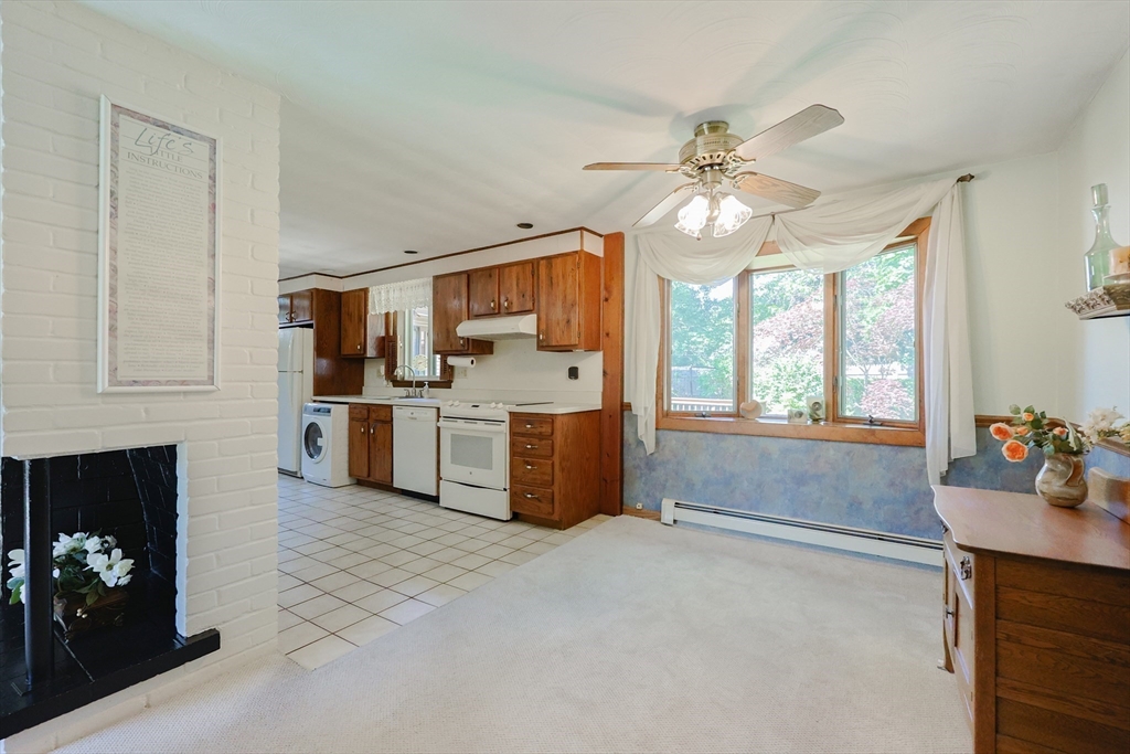 18 Paxton Road Framingham, MA 01701 - Photo 8 of 37 a kitchen with stainless steel appliances kitchen island granite countertop a refrigerator stove and sink