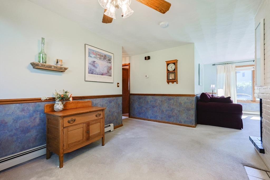 18 Paxton Road Framingham, MA 01701 - Photo 10 of 37 a living room with furniture and a baby crib