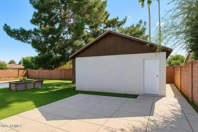 a view of backyard with green space