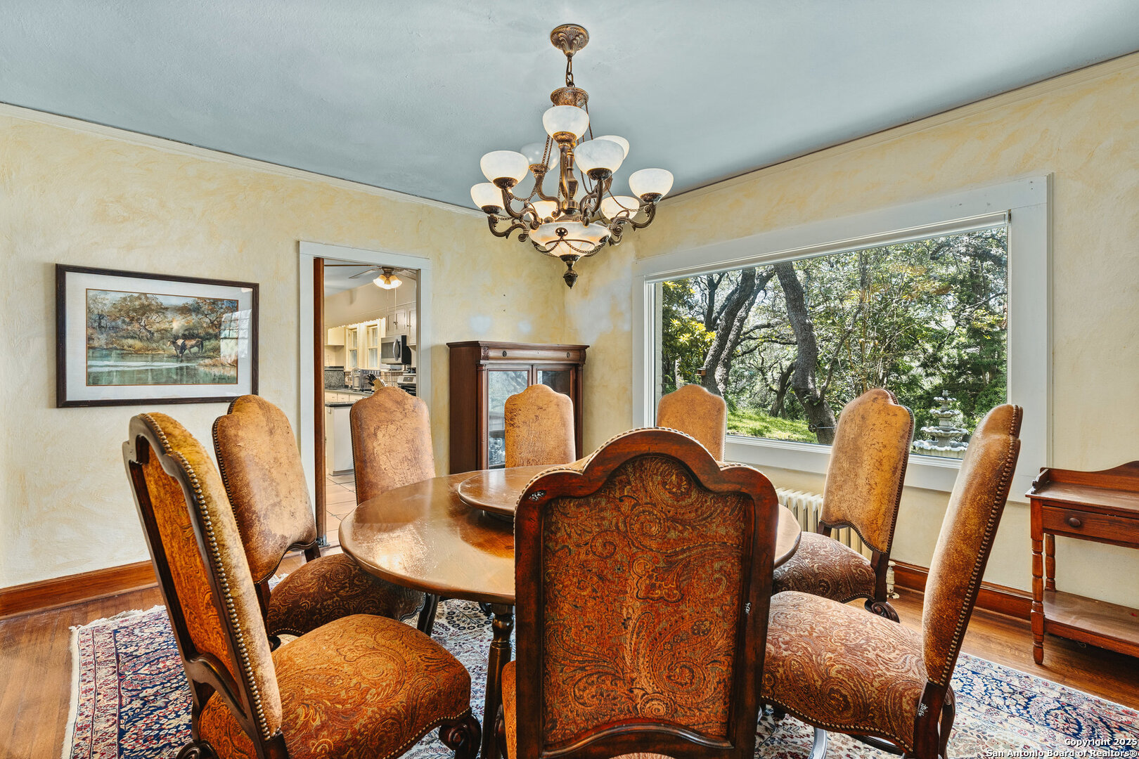5351 Fredericksburg Road San Antonio, TX 78229 - Photo 17 of 50 a view of a dining room with furniture a chandelier and large windows