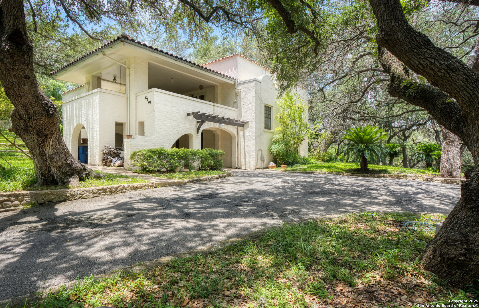 5351 Fredericksburg Road San Antonio, TX 78229 - Photo 2 of 50 a front view of house with yard and green space