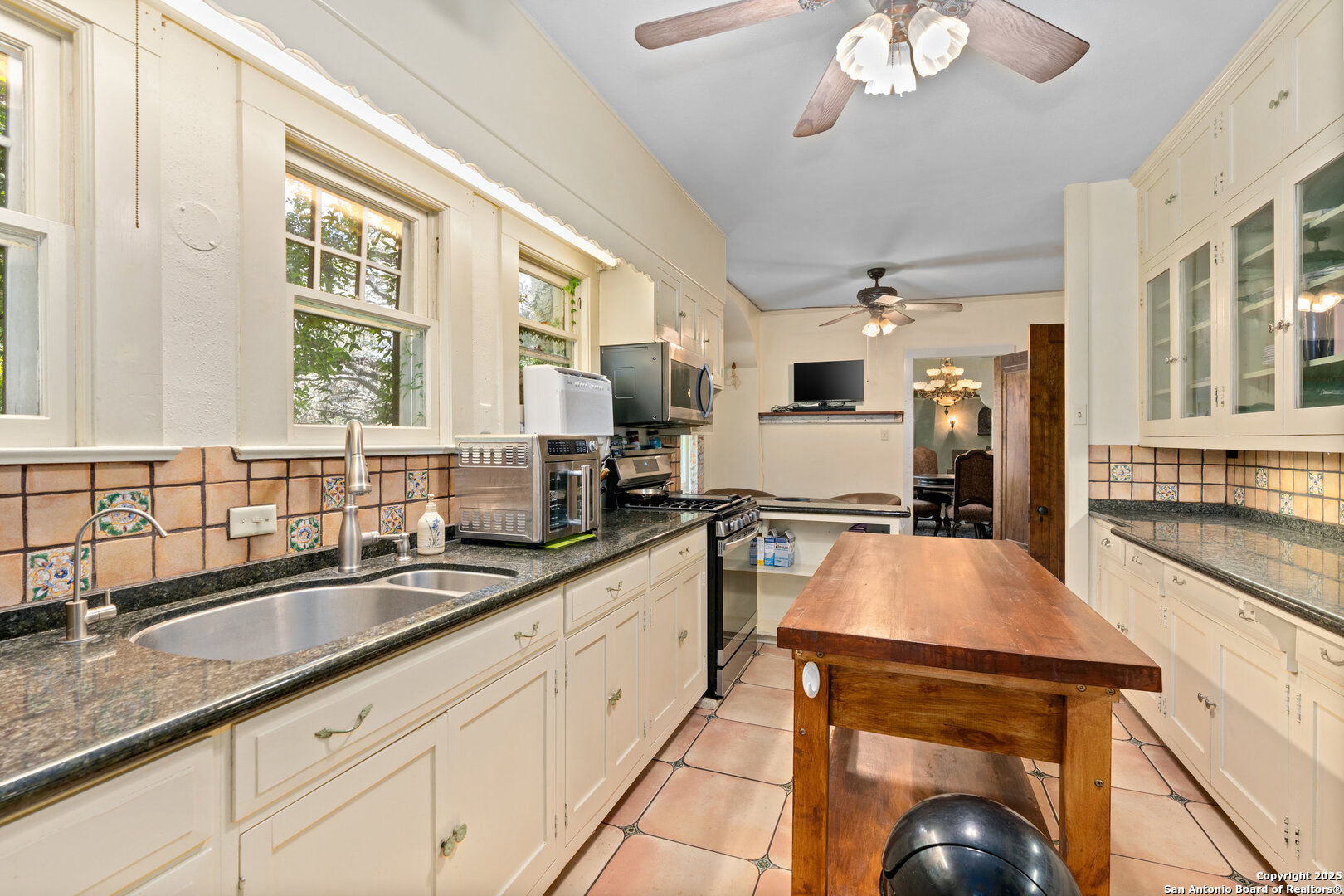 5351 Fredericksburg Road San Antonio, TX 78229 - Photo 21 of 50 a kitchen with stainless steel appliances granite countertop a sink stove and refrigerator