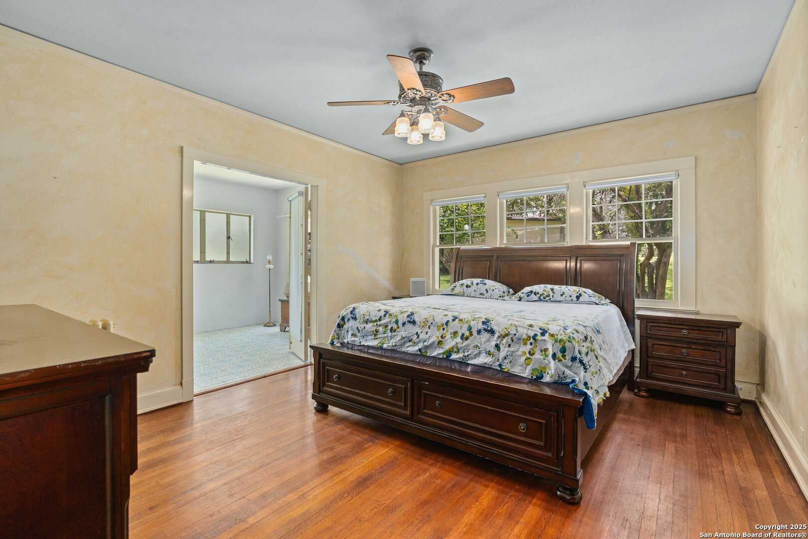 5351 Fredericksburg Road San Antonio, TX 78229 - Photo 24 of 50 a bedroom with a bed and a chandelier