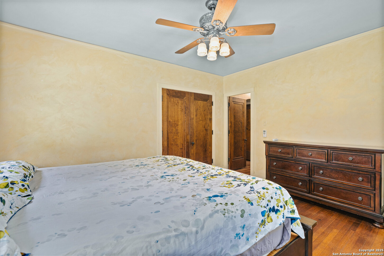 5351 Fredericksburg Road San Antonio, TX 78229 - Photo 25 of 50 a bedroom with a bed and a chandelier