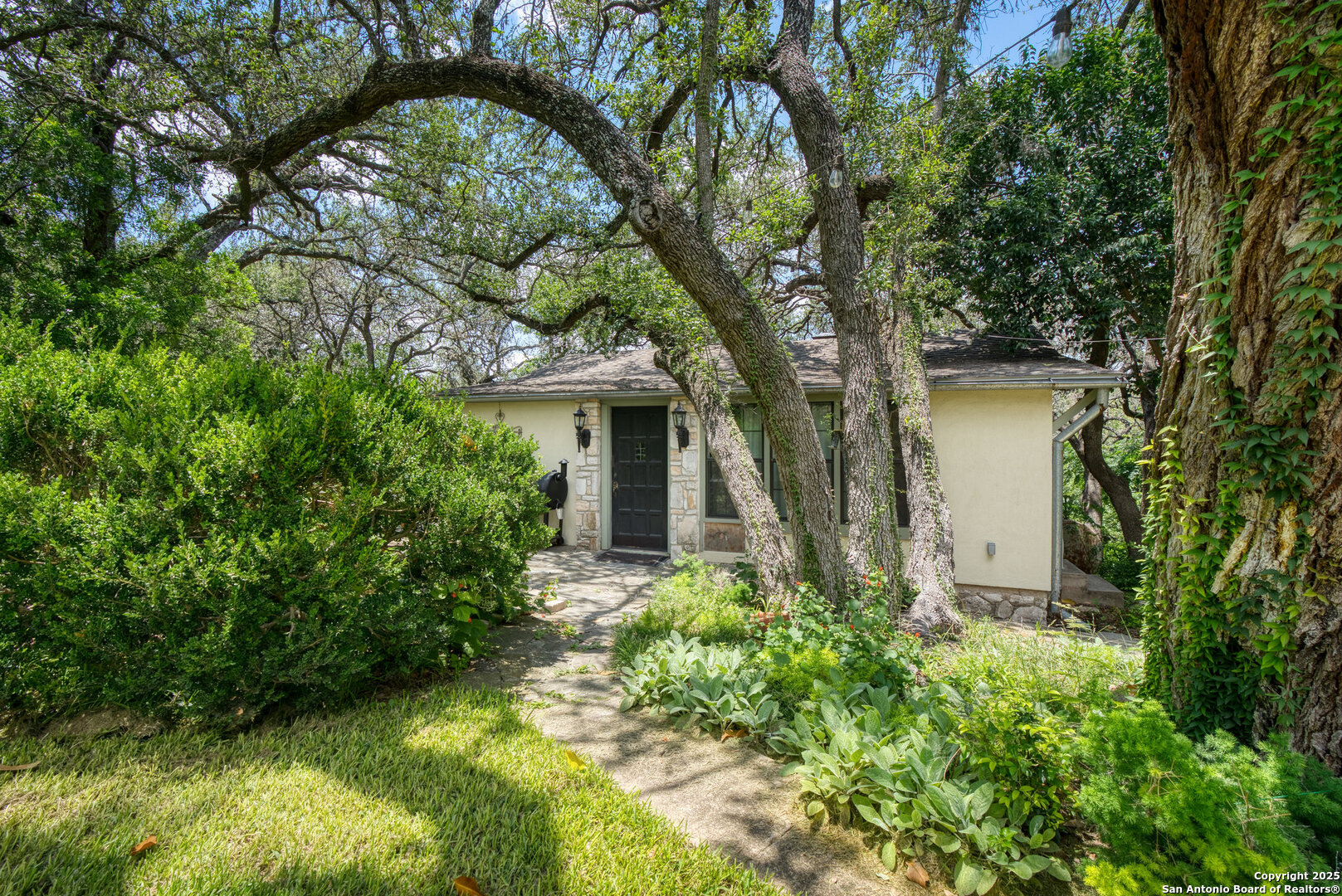 5351 Fredericksburg Road San Antonio, TX 78229 - Photo 35 of 50 a front view of a house with garden