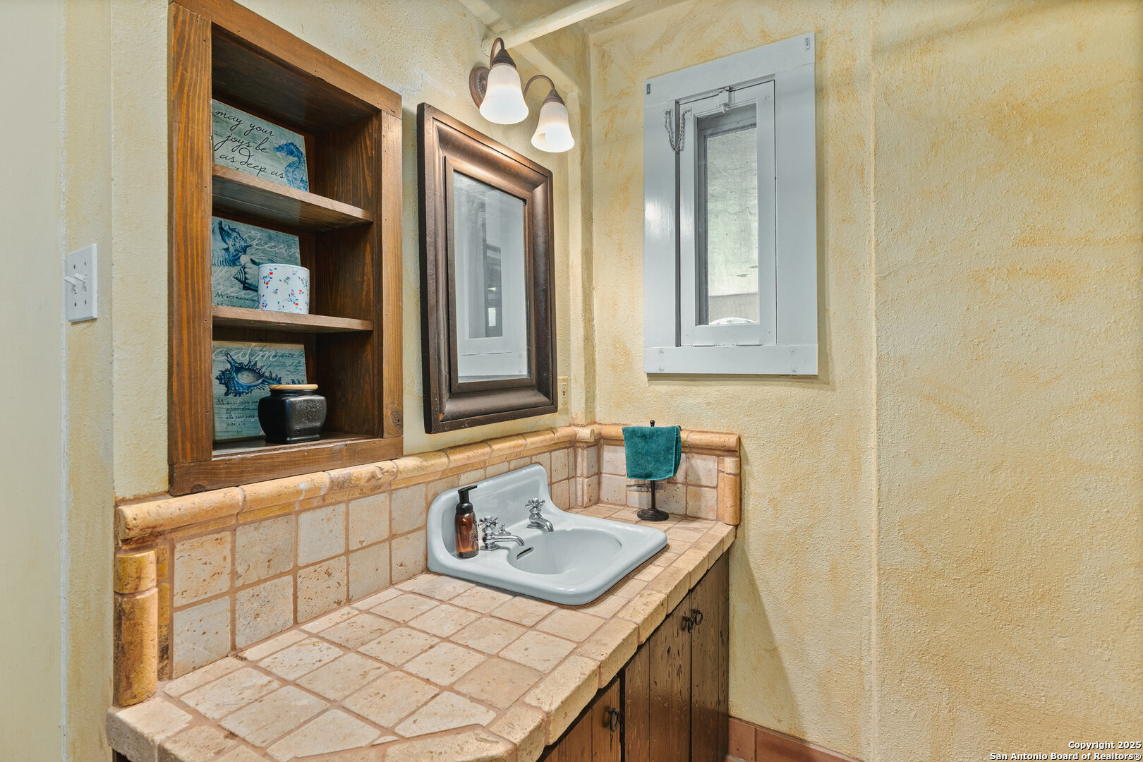 5351 Fredericksburg Road San Antonio, TX 78229 - Photo 5 of 50 a bathroom with a granite countertop sink and a mirror