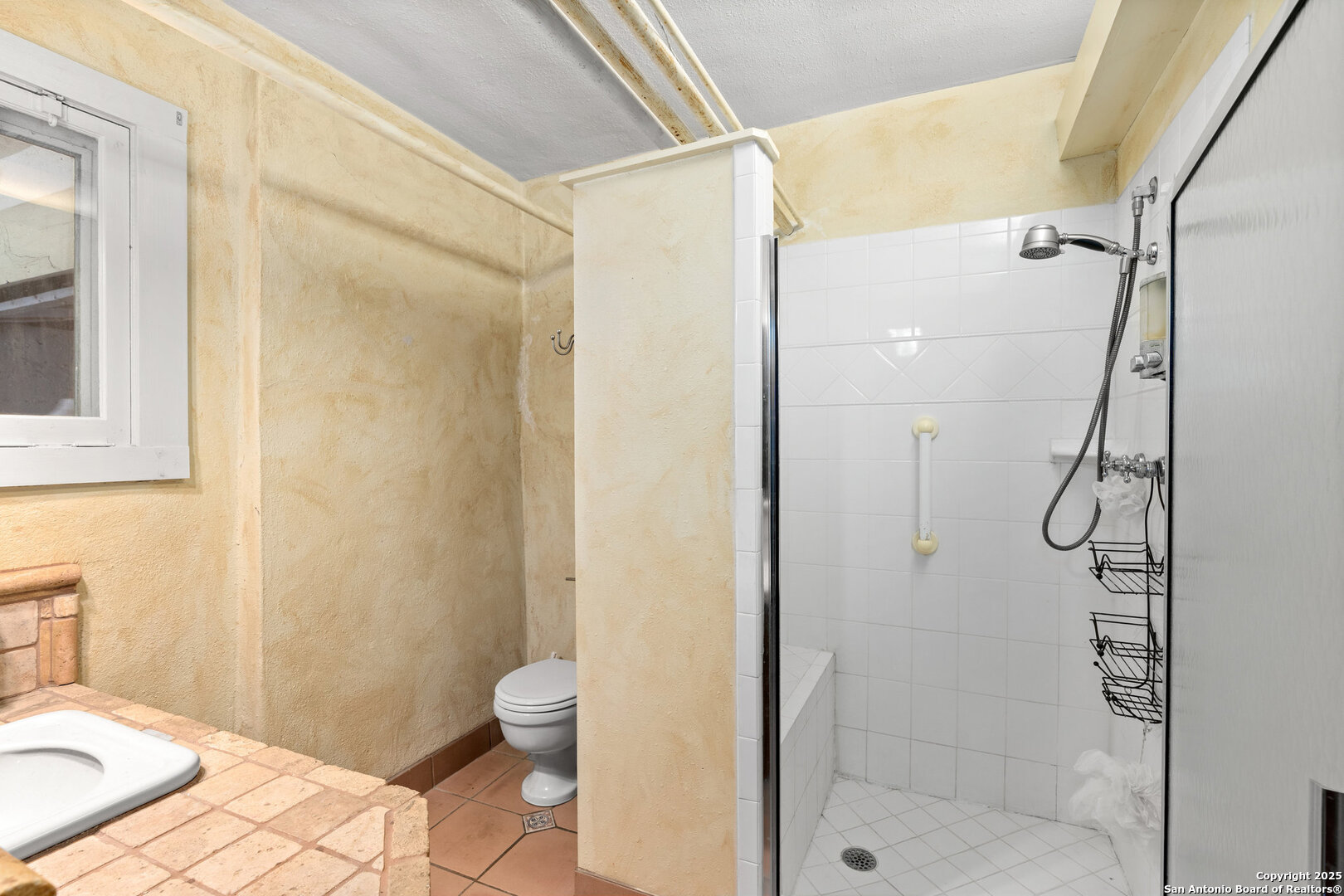 5351 Fredericksburg Road San Antonio, TX 78229 - Photo 6 of 50 a bathroom with a shower and a toilet