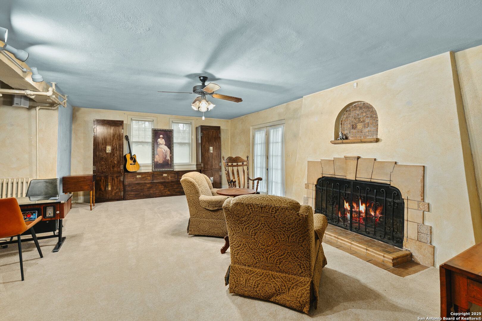 5351 Fredericksburg Road San Antonio, TX 78229 - Photo 8 of 50 a living room with furniture a fireplace and a chandelier