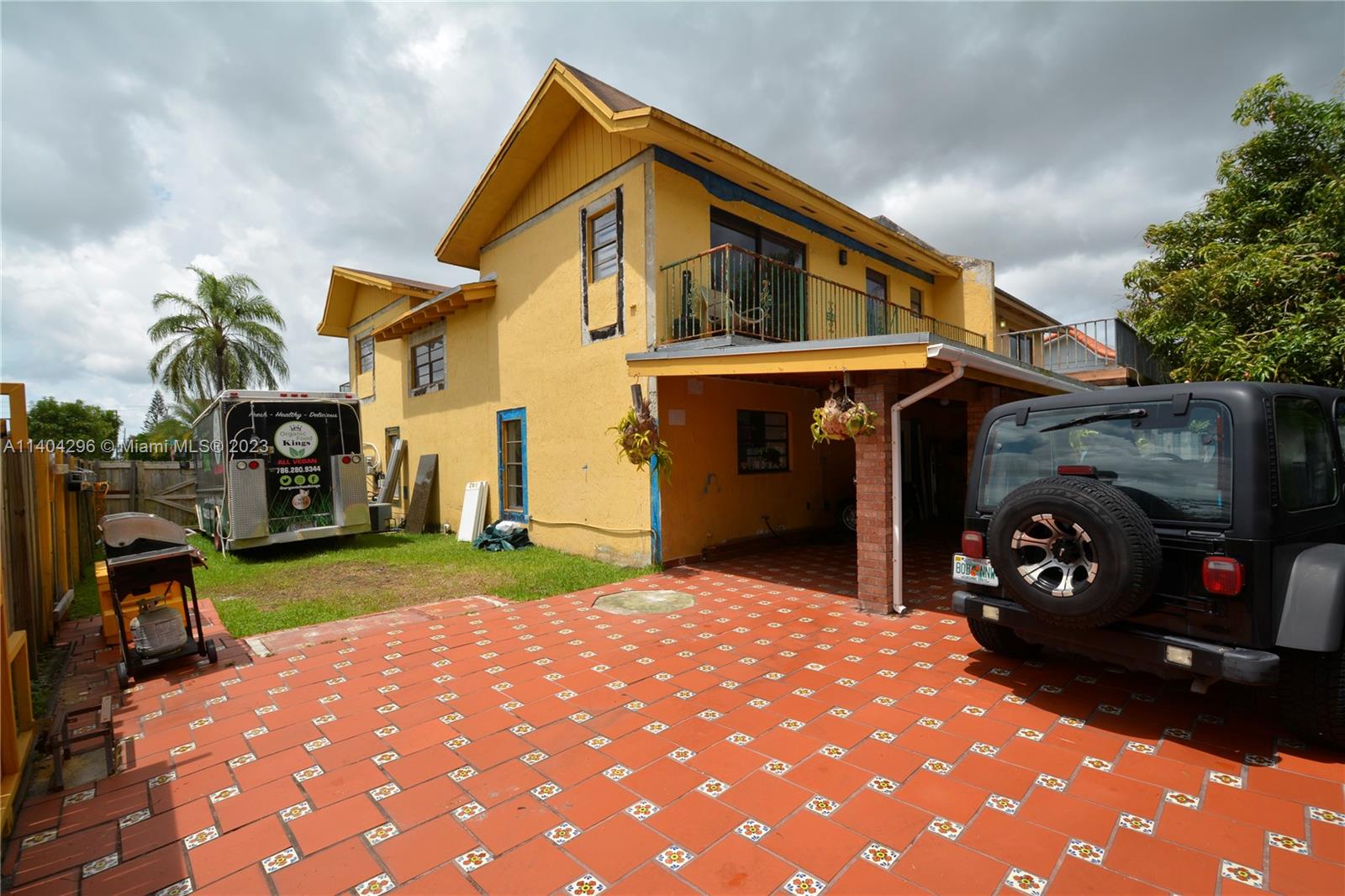 10915 Southwest 25th Street, Unit 2 Miami, FL 33165 - Photo 13 of 28 a front view of a house with a yard