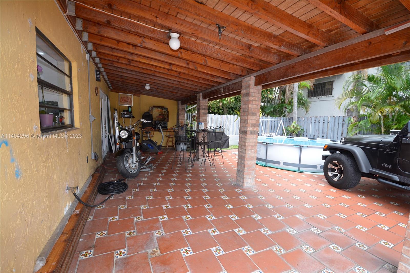 10915 Southwest 25th Street, Unit 2 Miami, FL 33165 - Photo 14 of 28 a view of a patio outdoor space with seating