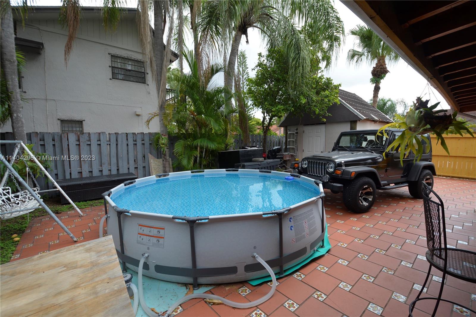 10915 Southwest 25th Street, Unit 2 Miami, FL 33165 - Photo 15 of 28 a view of outdoor space and deck