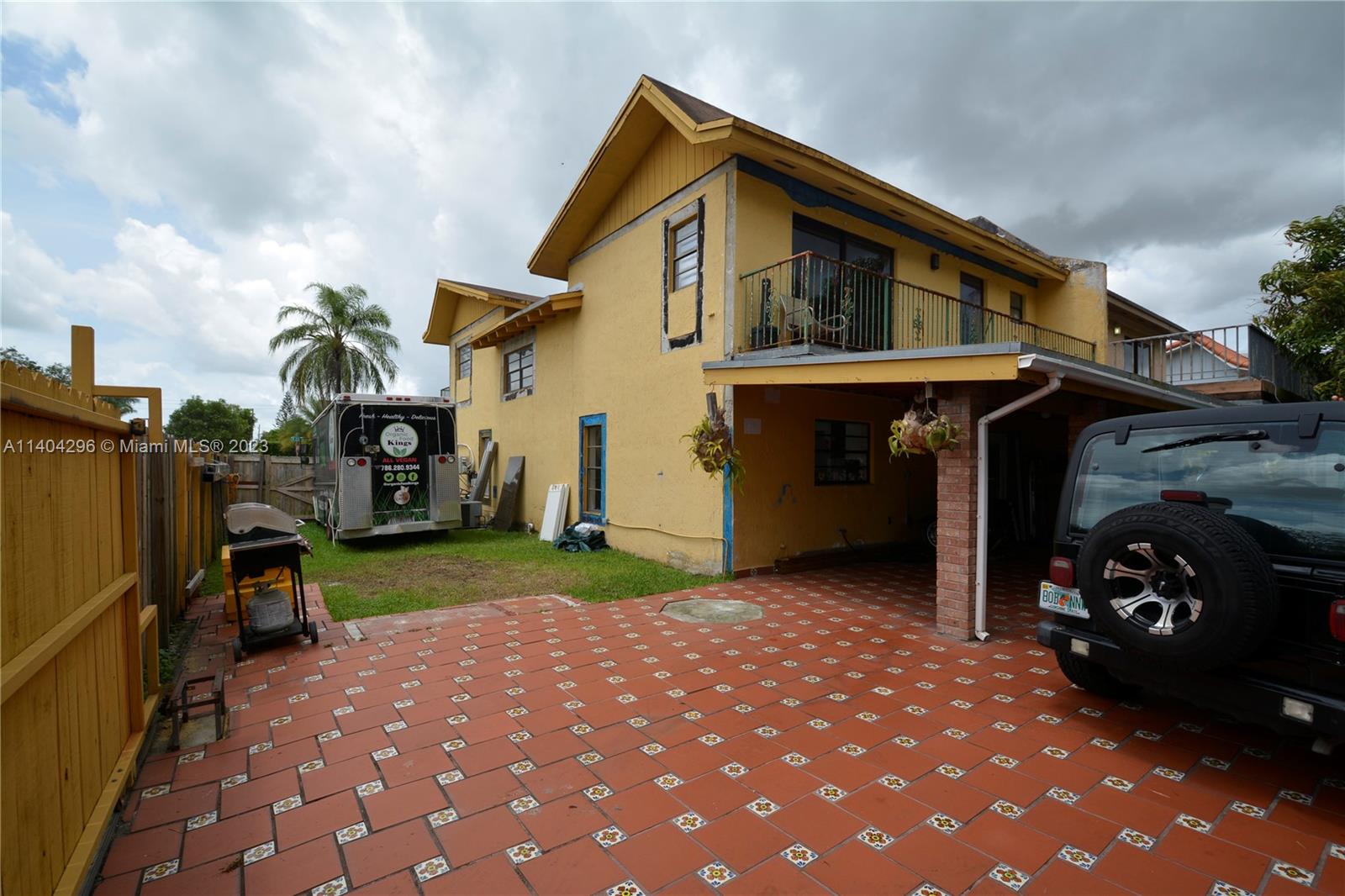 10915 Southwest 25th Street, Unit 2 Miami, FL 33165 - Photo 17 of 28 a view of a house and a yard