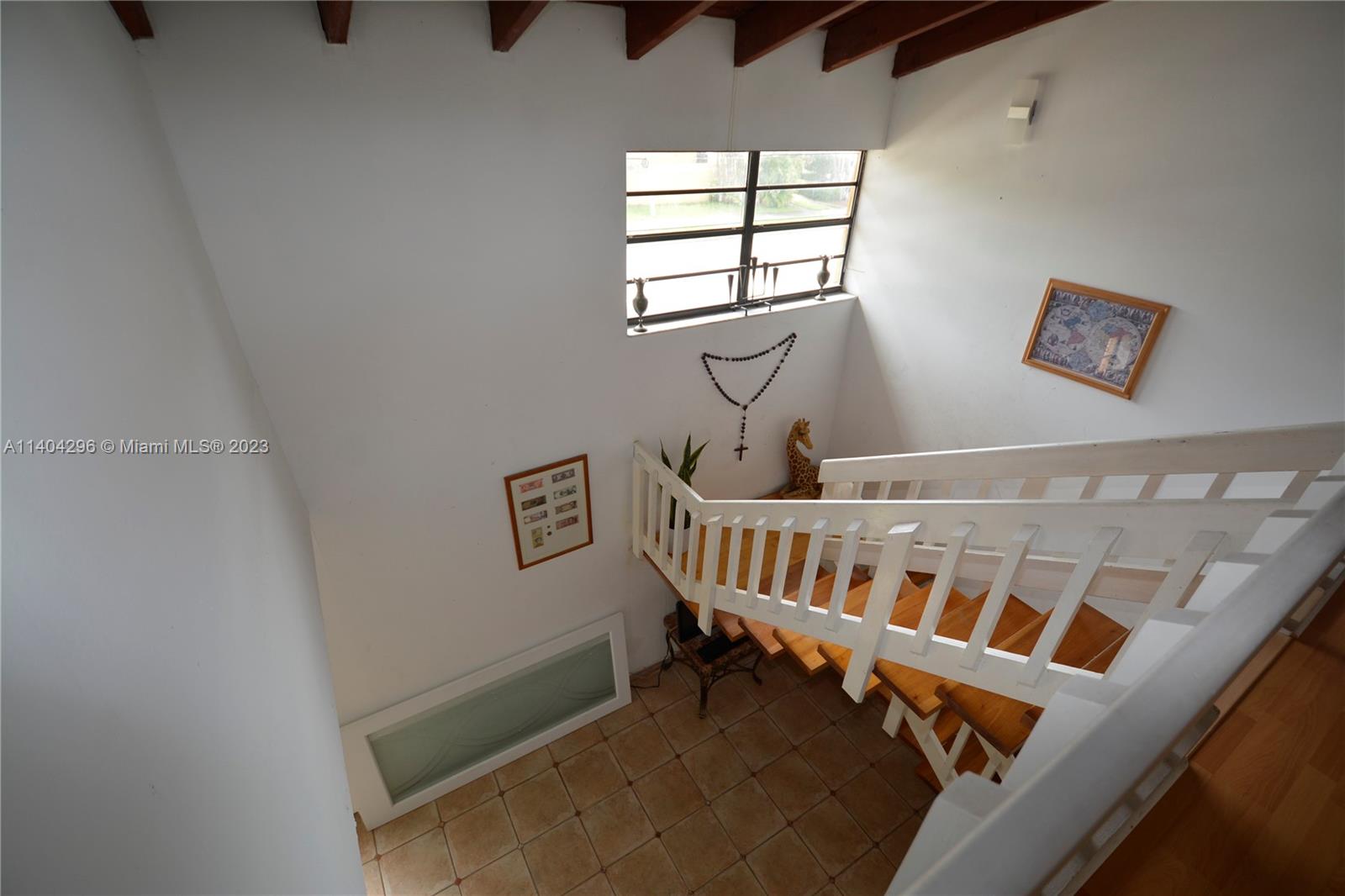 10915 Southwest 25th Street, Unit 2 Miami, FL 33165 - Photo 19 of 28 a view of an empty room with windows