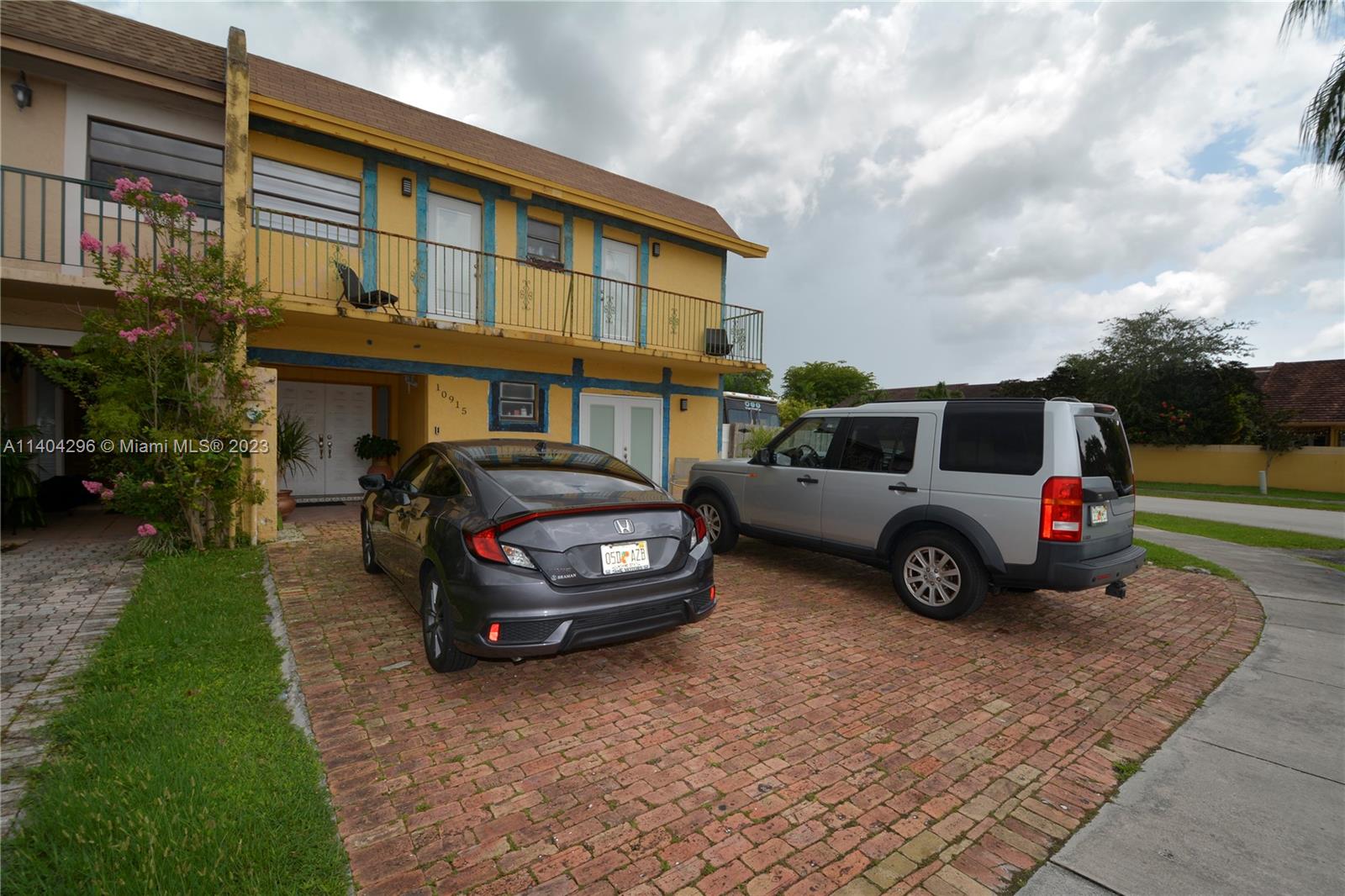 10915 Southwest 25th Street, Unit 2 Miami, FL 33165 - Photo 25 of 28 a car parked in front of a house