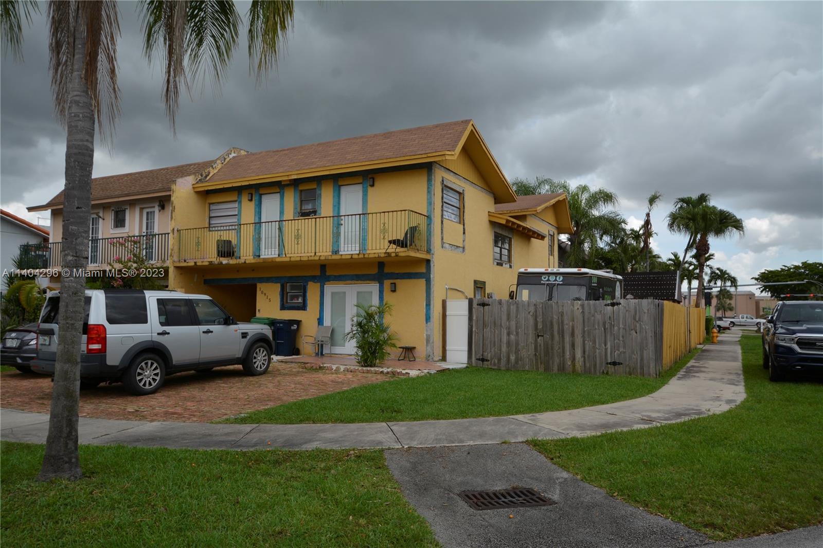 10915 Southwest 25th Street, Unit 2 Miami, FL 33165 - Photo 26 of 28 a cars parked in front of a brick house