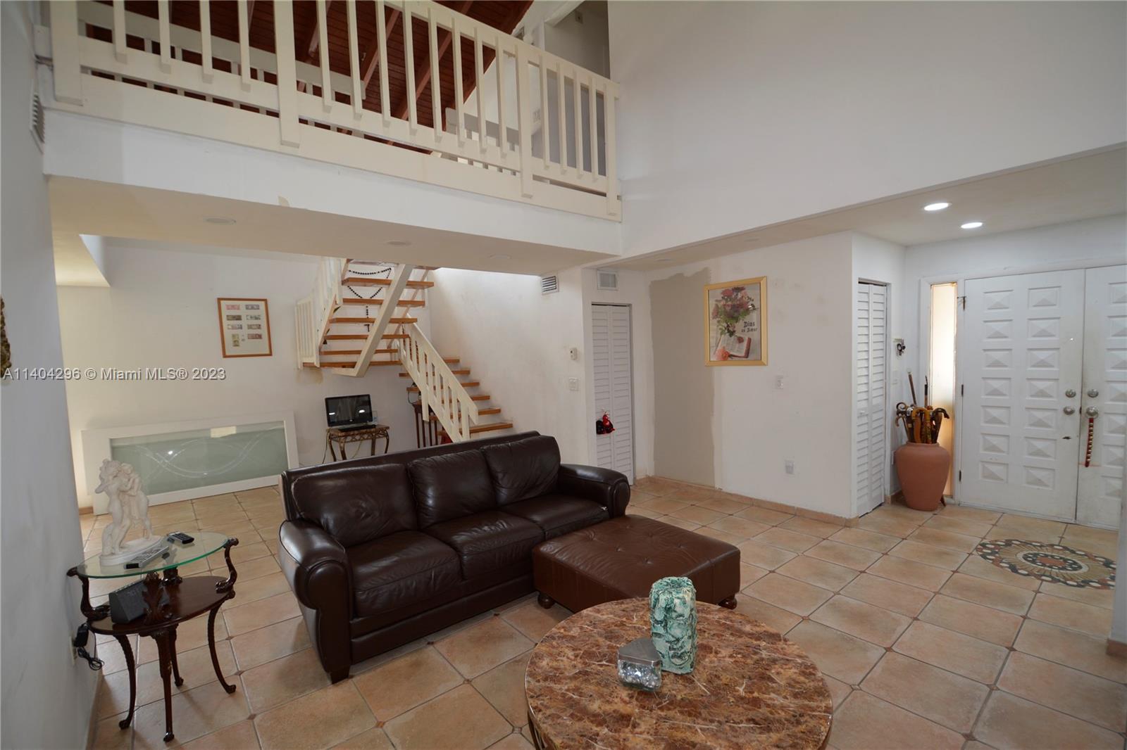 10915 Southwest 25th Street, Unit 2 Miami, FL 33165 - Photo 5 of 28 a living room with furniture and a rug