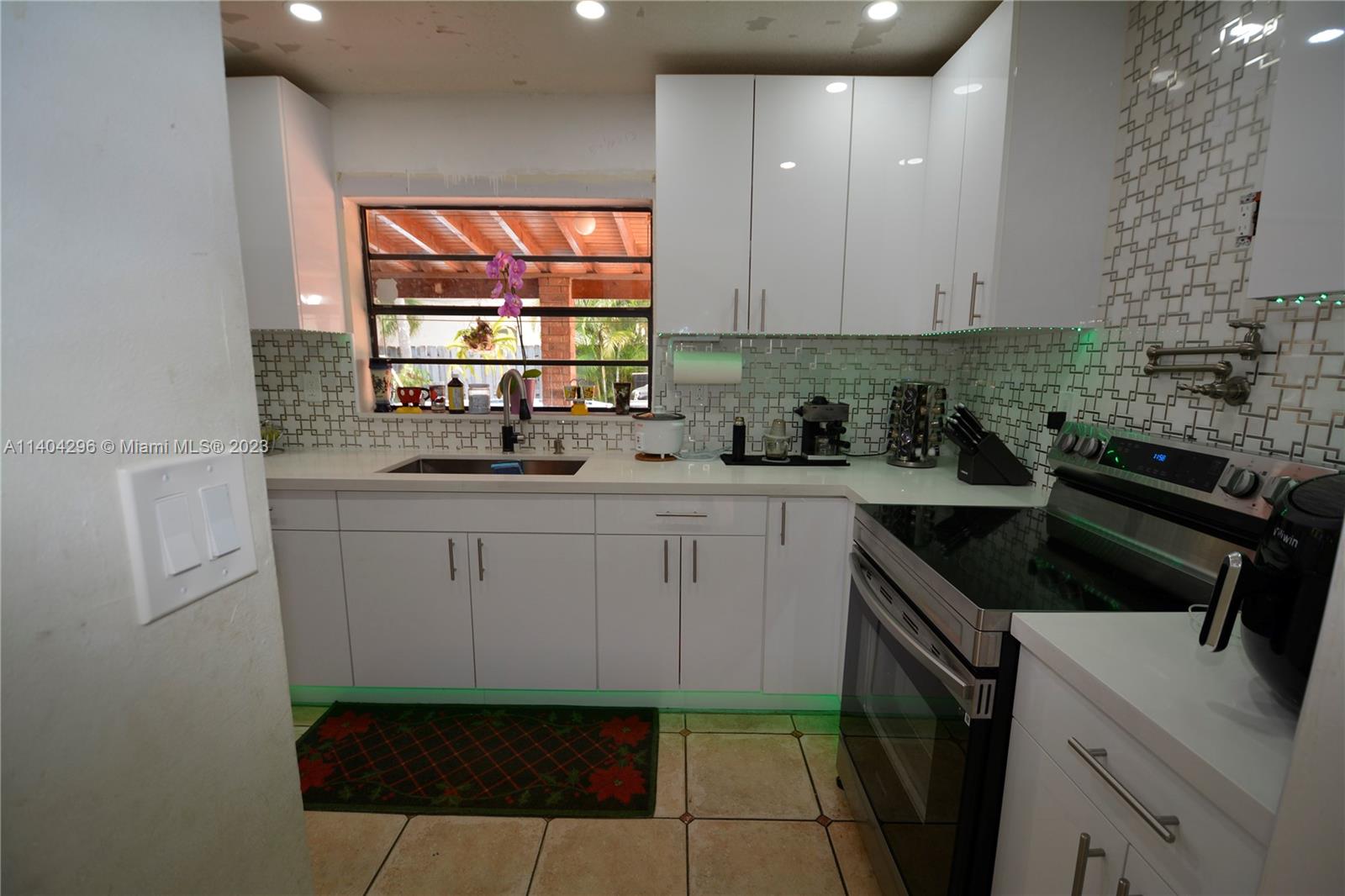 10915 Southwest 25th Street, Unit 2 Miami, FL 33165 - Photo 10 of 28 a kitchen with a sink and cabinets