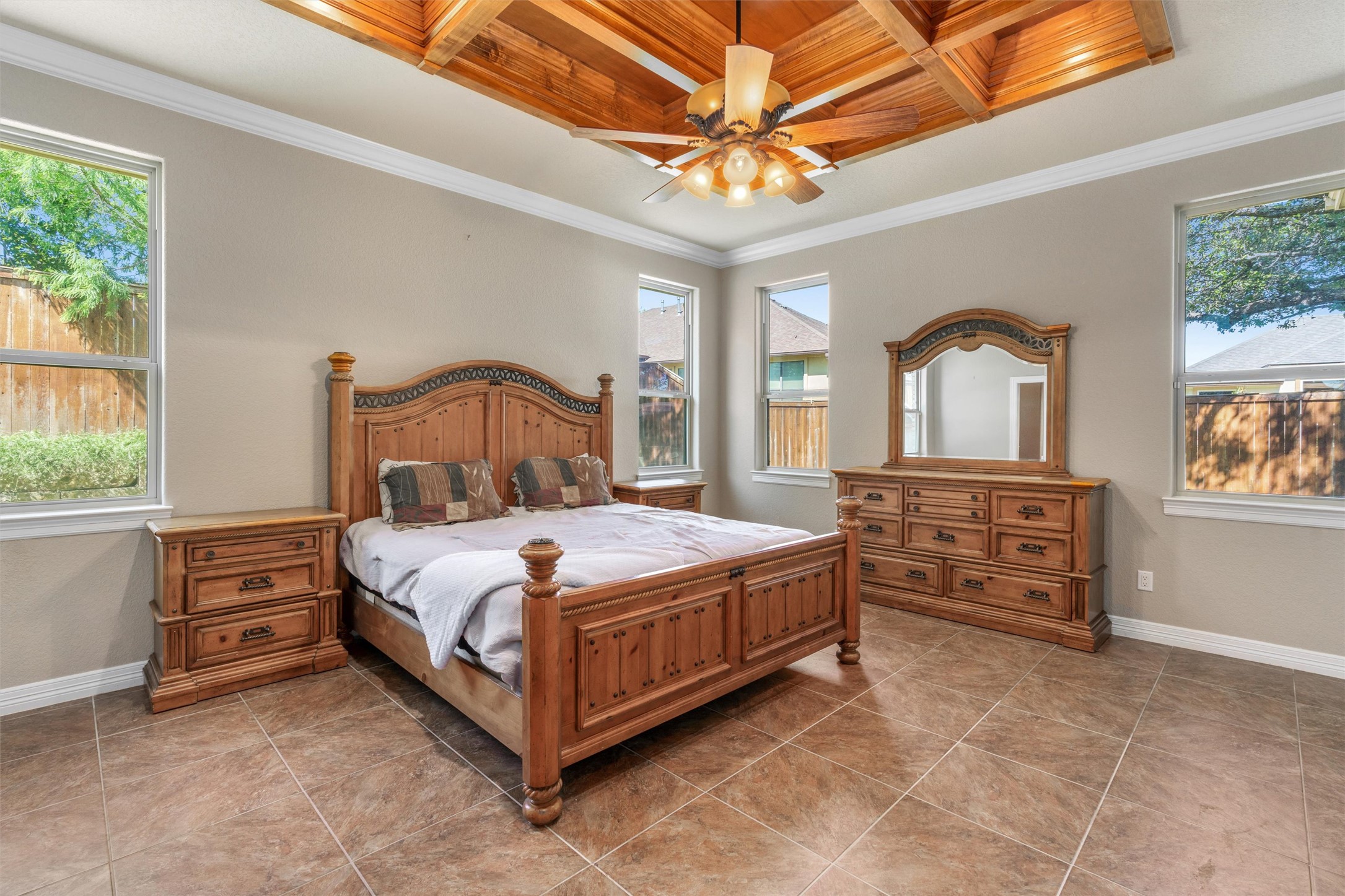 8006 Ridgeway Court Nolanville, TX 76559 - Photo 20 of 40 Bedroom featuring coffered ceiling, crown molding, wooden ceiling, multiple windows, and ceiling fan