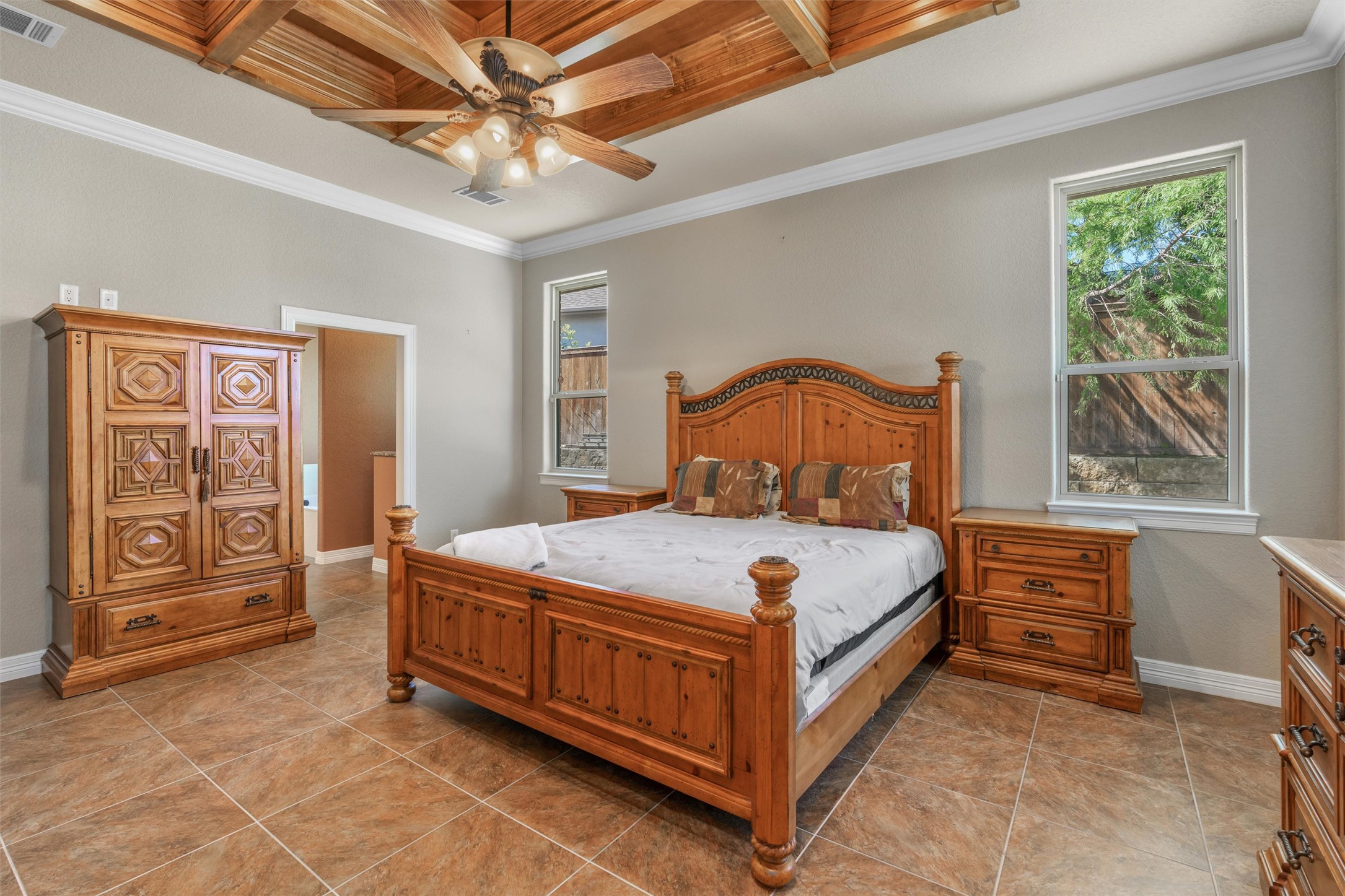 8006 Ridgeway Court Nolanville, TX 76559 - Photo 21 of 40 Bedroom featuring ornamental molding, a ceiling fan, light tile patterned floors, and wooden ceiling